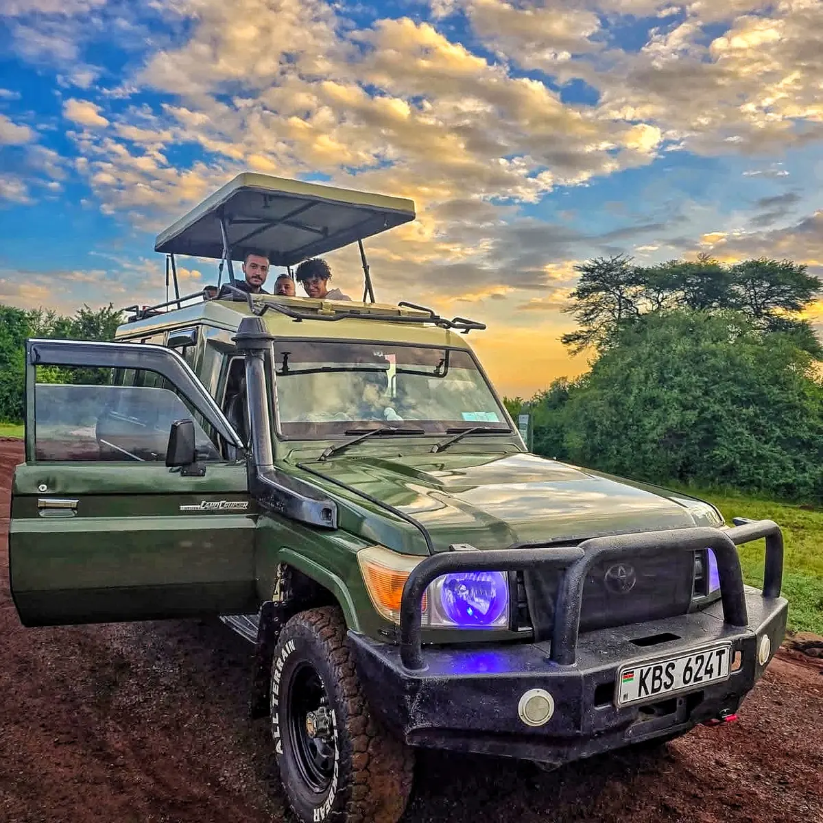 Land Cruiser silhouetted at sunset