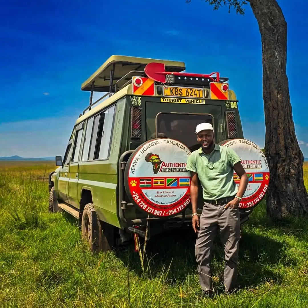 Safari guide with a Land Cruiser in the Mara