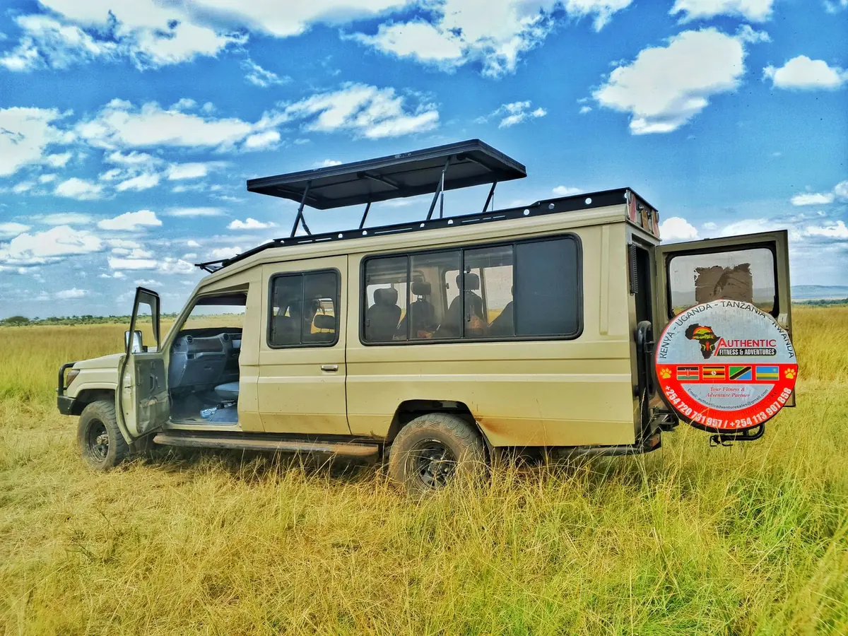 Safari Land Cruiser on the open Masai Mara plains